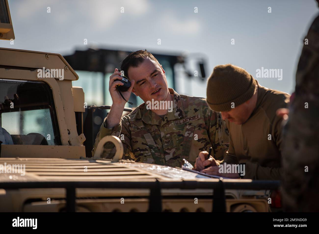 U.S. Air Force Tech. Sgt. Dominic Jones, right, and Staff Sgt. Tyler Van Every, both 60th Aerial Port Squadron joint inspectors, inspect cargo and equipment for an upcoming mission at Travis Air Force Base, California, March 29, 2022. U.S. forces deployed to multiple NATO nations to assure Allies and deter further aggression in the region. The 621st Contingency Response Wing is specialized in training and rapidly deploying personnel to quickly open airfields and establish, expand, sustain and coordinate air mobility operations. Stock Photo