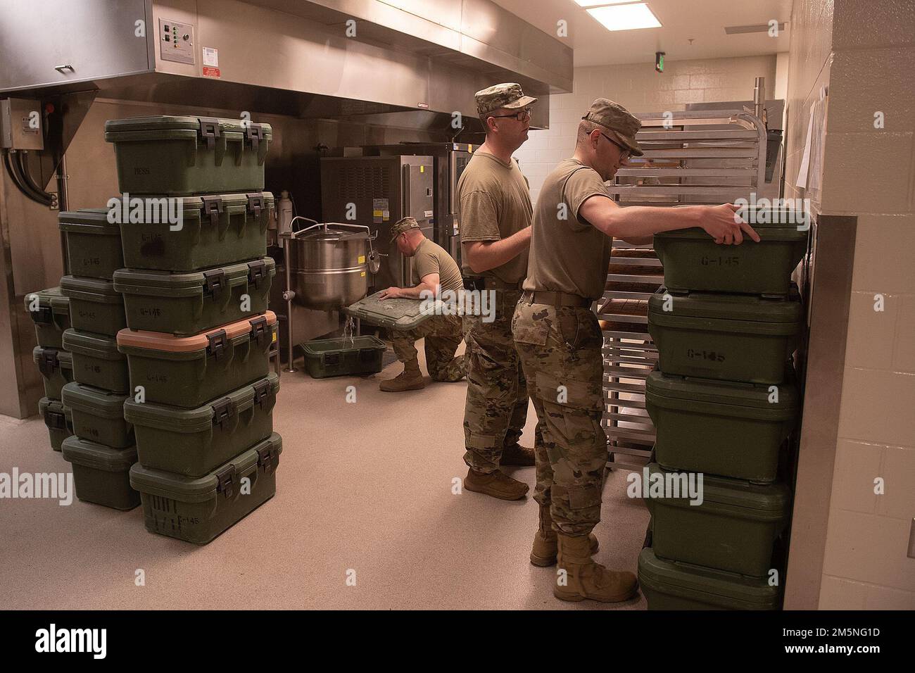 Soldiers from G Company of the Idaho Army National Guard continue to prepare the log packs to load meals.  Napoleon Bonaparte is attributed as saying - “An army marches on it’s stomach.” The saying conveys the importance that soldiers in the field cannot be effective unless they are well fed.    The Idaho Army National Guard's 2-116th Combined Arms Battalion was in the field on the Orchard Combat Training Center in the final days of March, in preparation for an upcoming deployment in support of Operation Spartan Shield.    The training was rigorous and diverse. While each company completed the Stock Photo