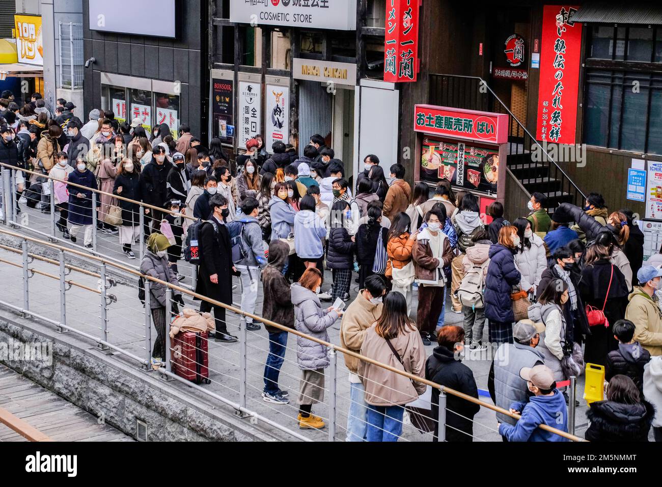 People shop along the streets of Shinsaibashi in Osaka, Japan