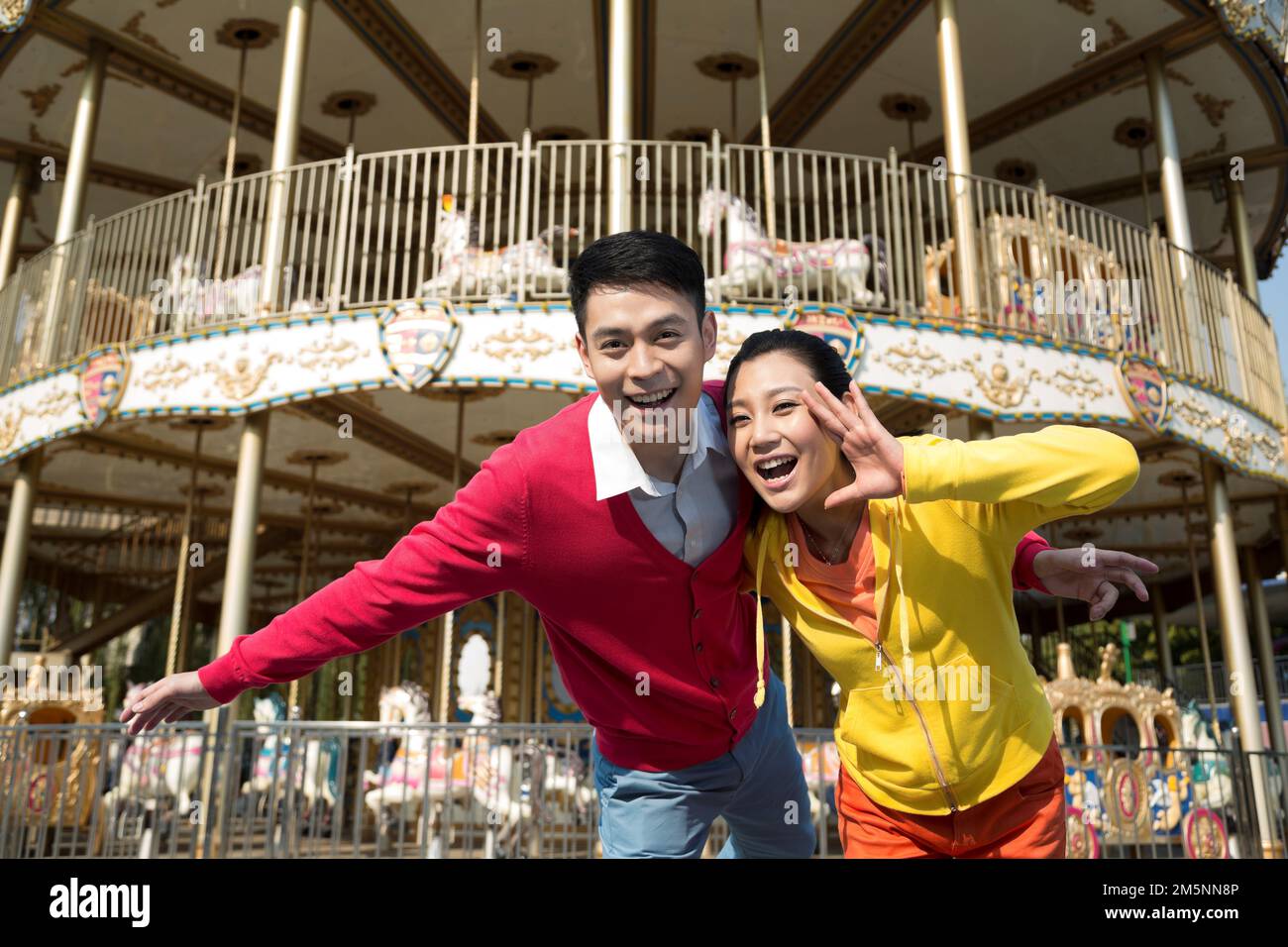 Young couples to play in the amusement park Stock Photo - Alamy