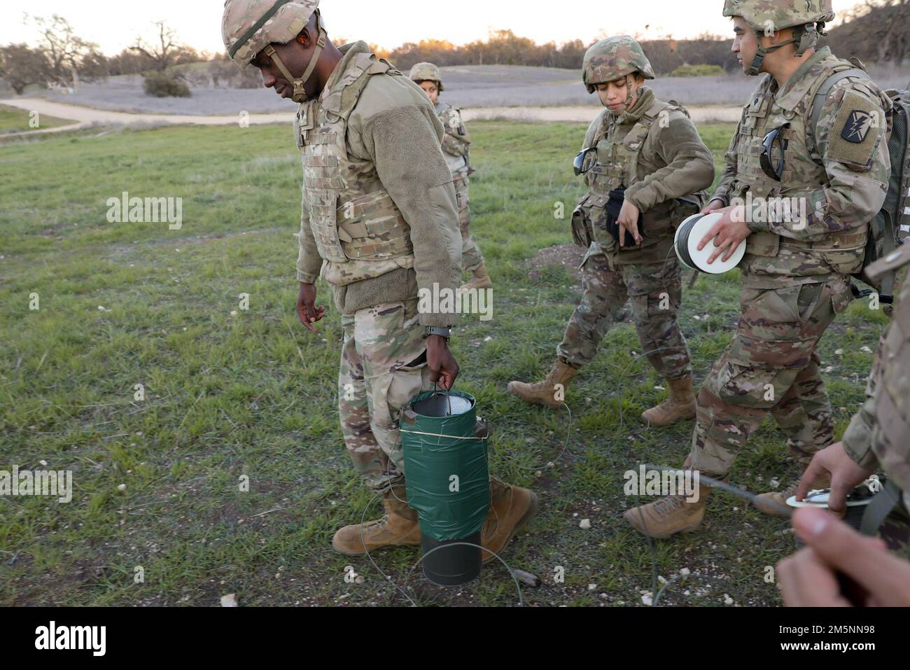 California National Guard combat engineers of the 578th Brigade Engineer Battalion prepare cratering charges for detonation on Fort Hunter Liggett, Calif., February 25, 2022. A cratering charge is used to deny and disrupt mobility of the enemy by creating a cavity in the ground. Stock Photo