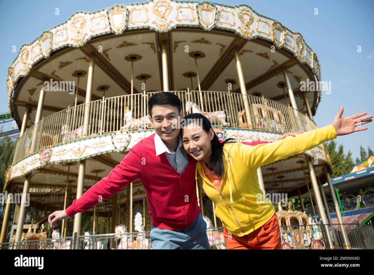 Young couples to play in the amusement park Stock Photo - Alamy
