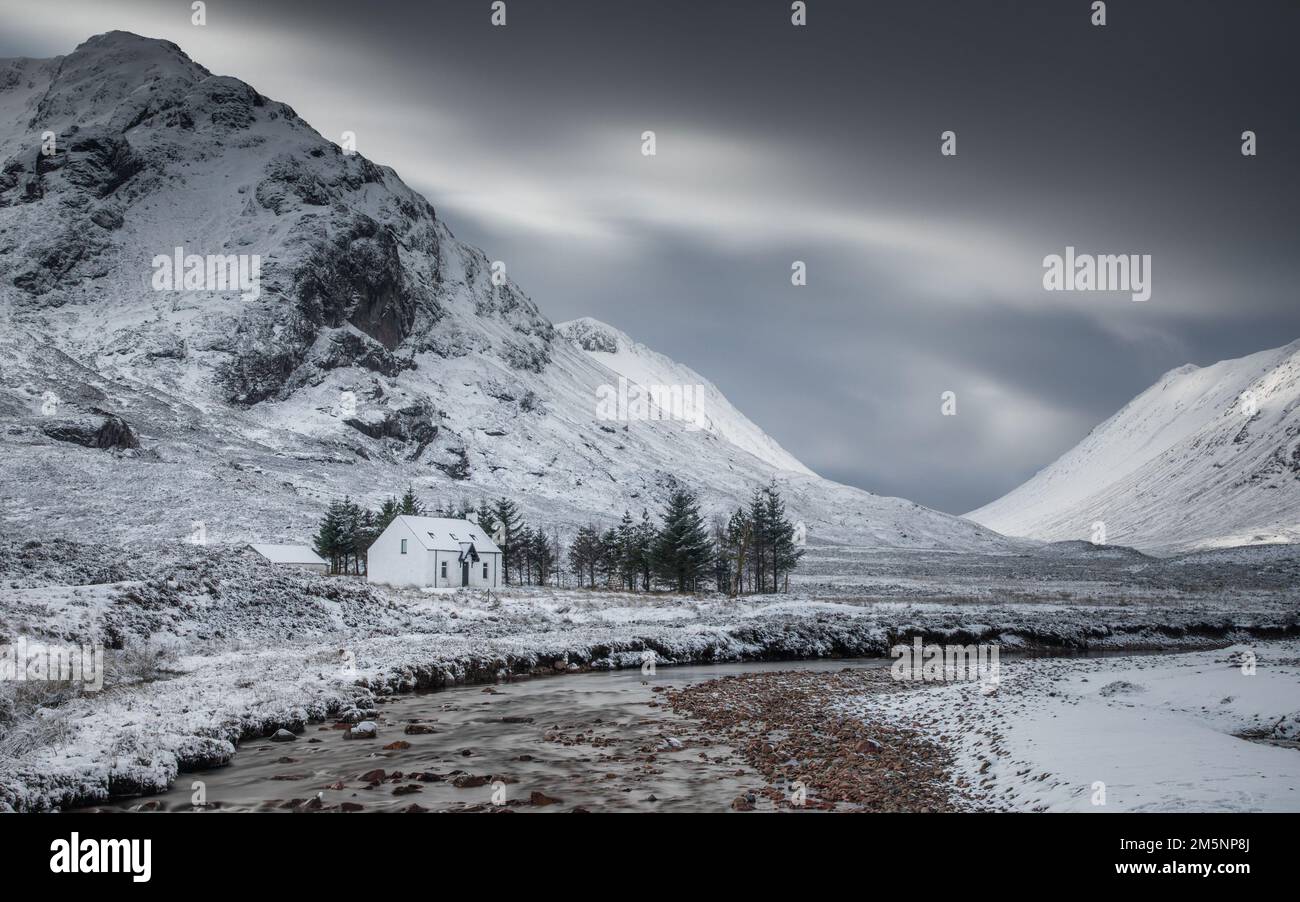 Glencoe winter scene  in the Scottish Highlands. Rugged snow covered scenery and landscapes in the mountains near Loch Ness and Fort William. Stock Photo