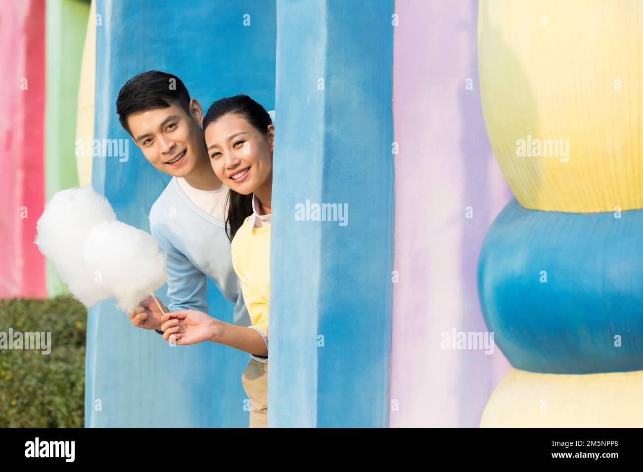 Young couples to play in the amusement park Stock Photo - Alamy