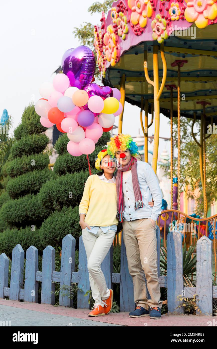 Young couples to play in the amusement park Stock Photo - Alamy