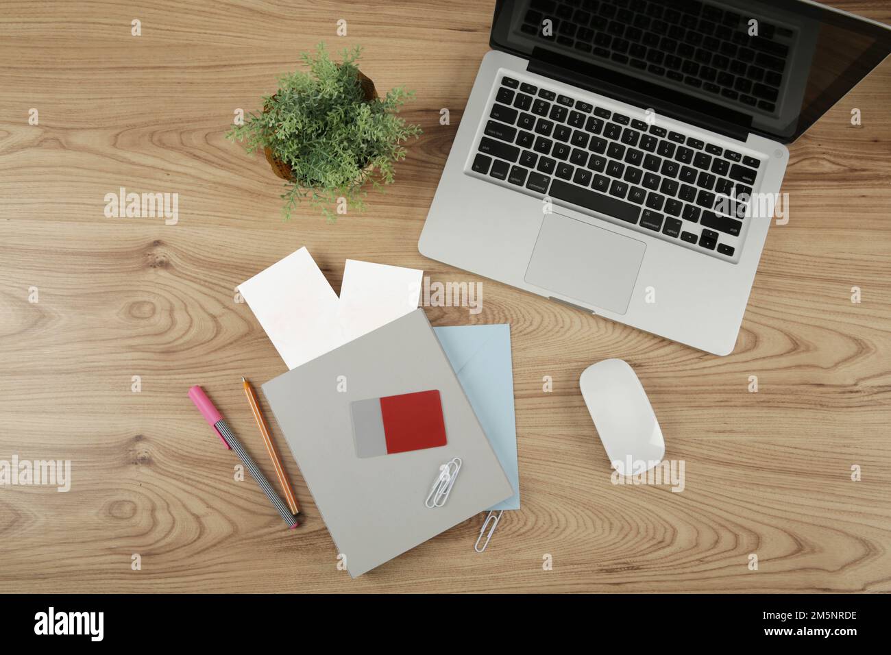 computer notebook and tickets on wooden desk Stock Photo - Alamy