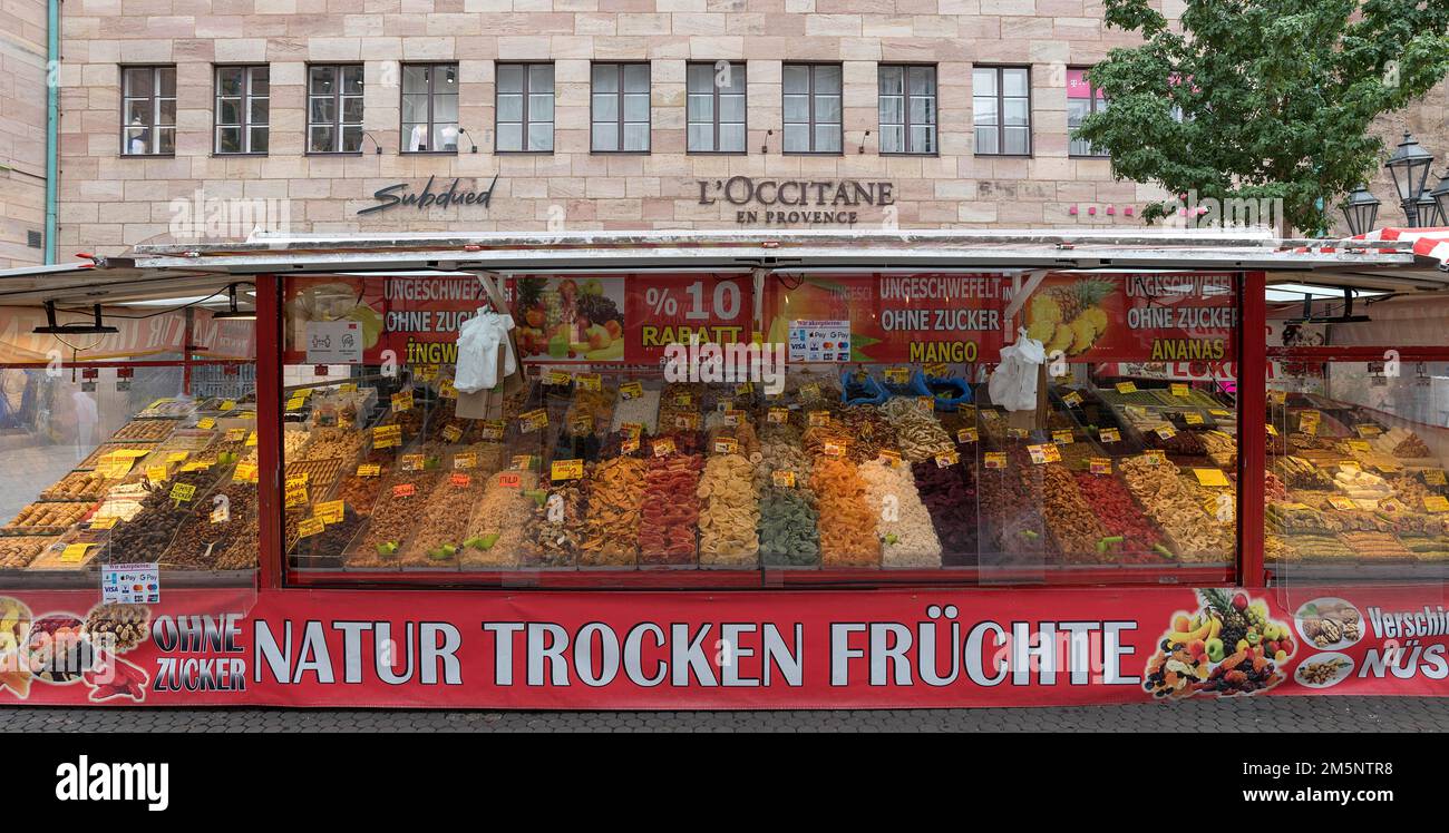 Market stall with dried fruits in the pedestrian zone, Bavaria, Germany