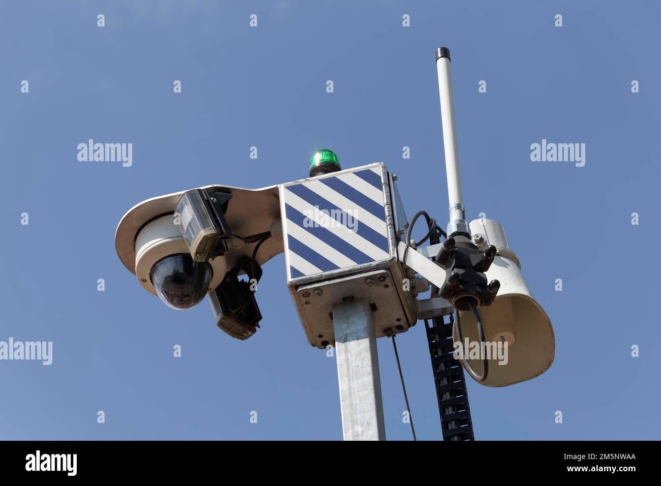 Surveillance camera with loudspeaker on a construction site, video