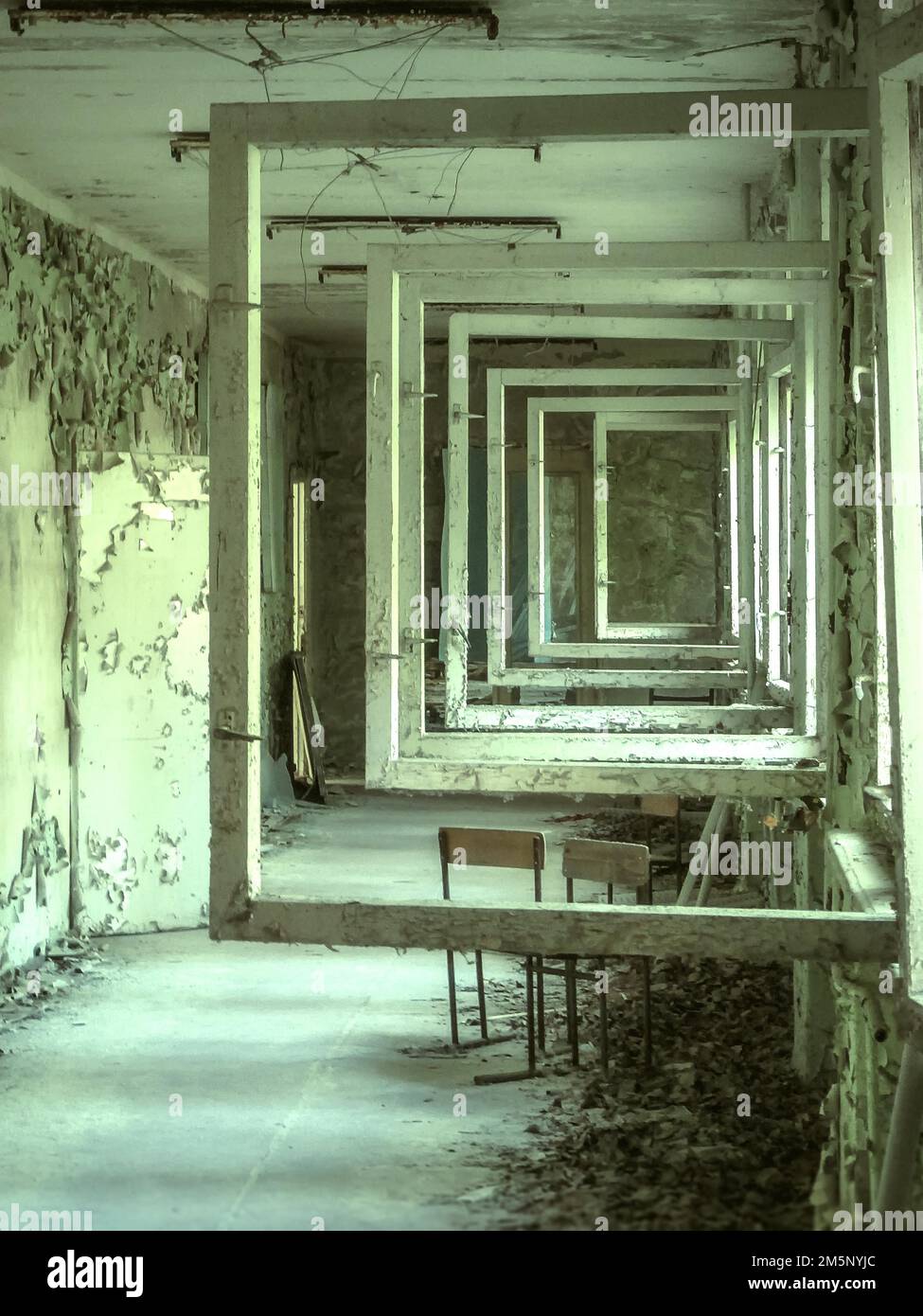 Corridor with open windows, Middle school #3, Lost Place, Prypyat, Chernobyl exclusion zone, Ukraine, Eastern Europe Stock Photo