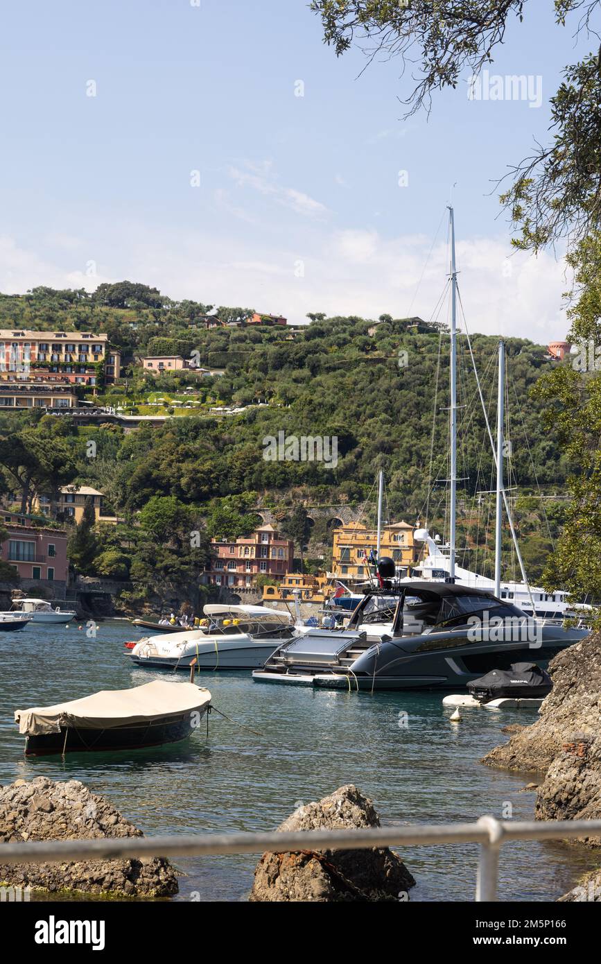 Bay of little seaside town Portofino with luxury yachts and boats.  Portofino is a fishing village on the Italian Riviera coastline, southeast of Geno Stock Photo