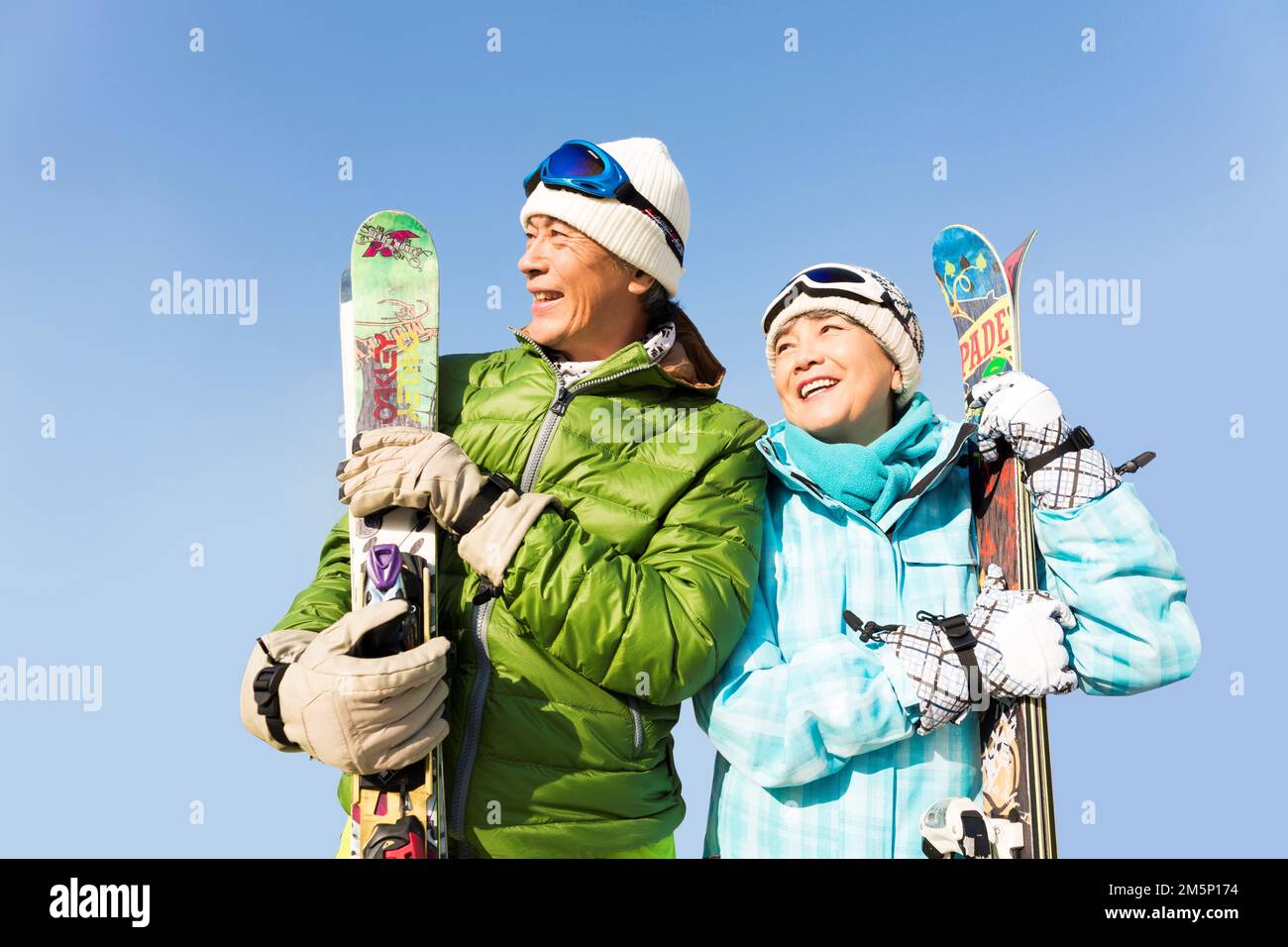 Elderly couple winter skiing Stock Photo