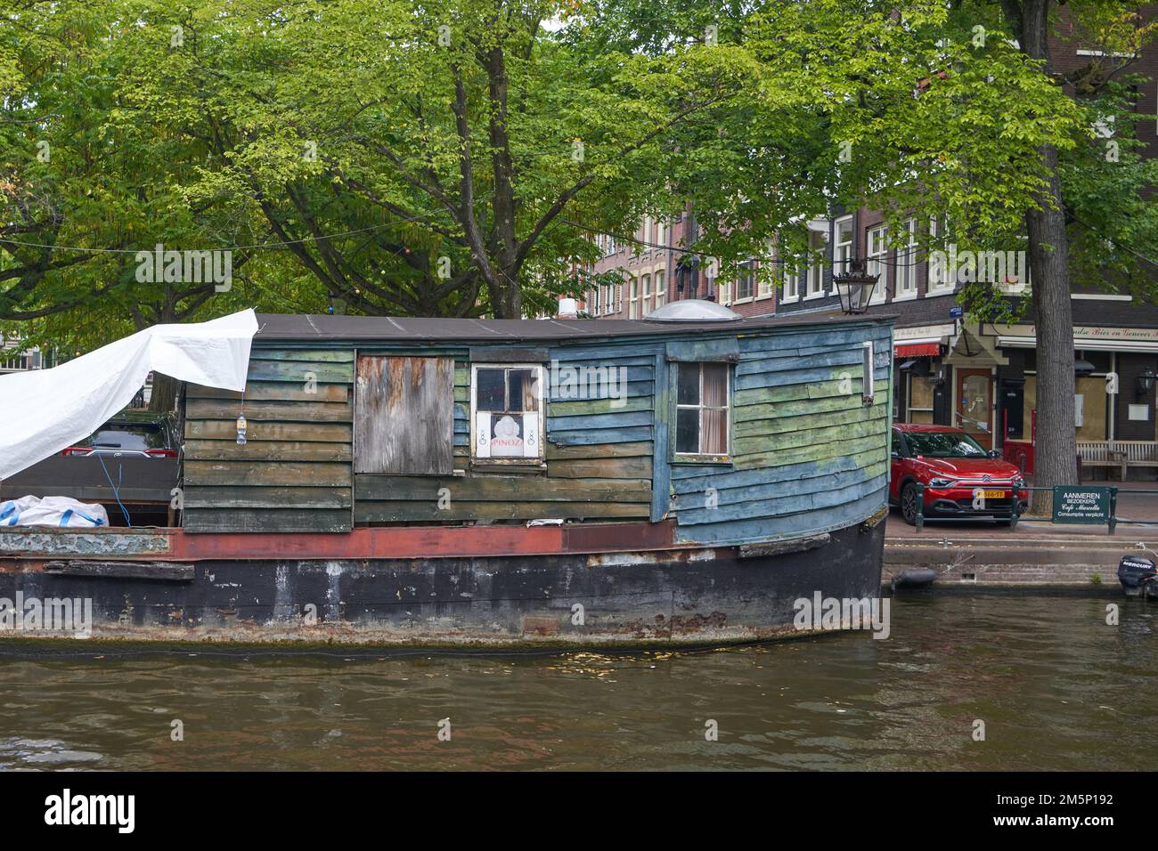 Houseboats lying in a canal in Amsterdam Amsterdam, North Holland