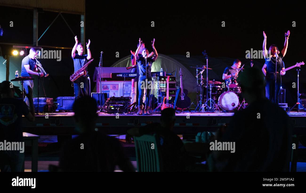 Members of the U.S. Air Forces Central Band perform a concert at Prince Sultan Air Base, Kingdom of Saudi Arabia, Feb. 26, 2022. The AFCENT Band supports the morale of deployed troops by playing various concerts around the region. Stock Photo