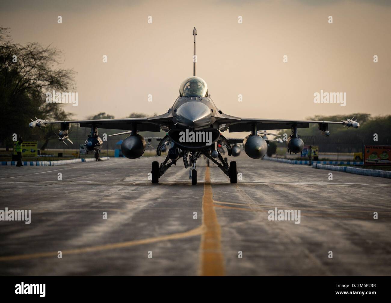 A 332d Air Expeditionary Wing F-16 Fighting Falcon aircraft taxis to an aircraft shelter after landing at a Pakistan operational air force base, Feb. 26, 2022. U.S. Air Force members from across the Air Forces Central area of responsibility deployed in support of Falcon Talon 2022, an Agile Combat Employment operation, to conduct the first bilateral training event between the United States and Pakistan since 2019. Stock Photo