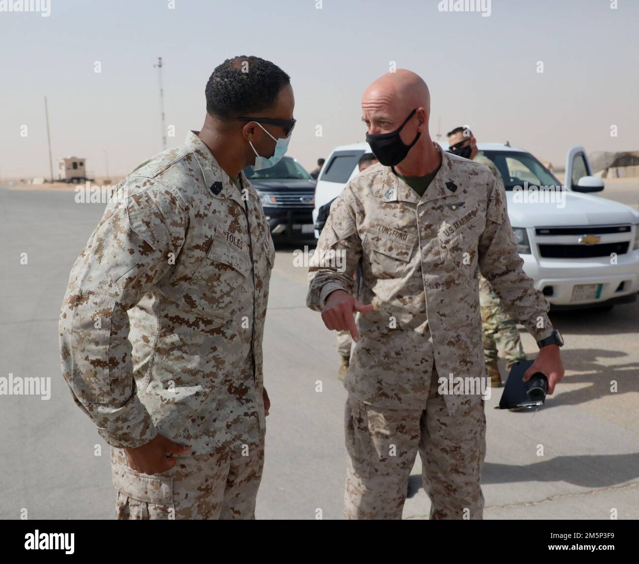 U.S. Marine Corps Sergeant Maj. Steven Lunsford, U.S. Marine Corps Forces Central Command speaks with Sergeant Maj. Joshua Toles, Marine Fighter Attack Squadron 115 (VMFA-115) during his visit to Prince Sultan Air Base, Kingdom of Saudi Arabia on Feb. 27, 2022.VMFA-115 has been deployed to Prince Sultan Air Base in the Kingdom of Saudi Arabia since December 2021 and are an integral part of the Immediate Response Force in the Central Command area of responsibility. Stock Photo