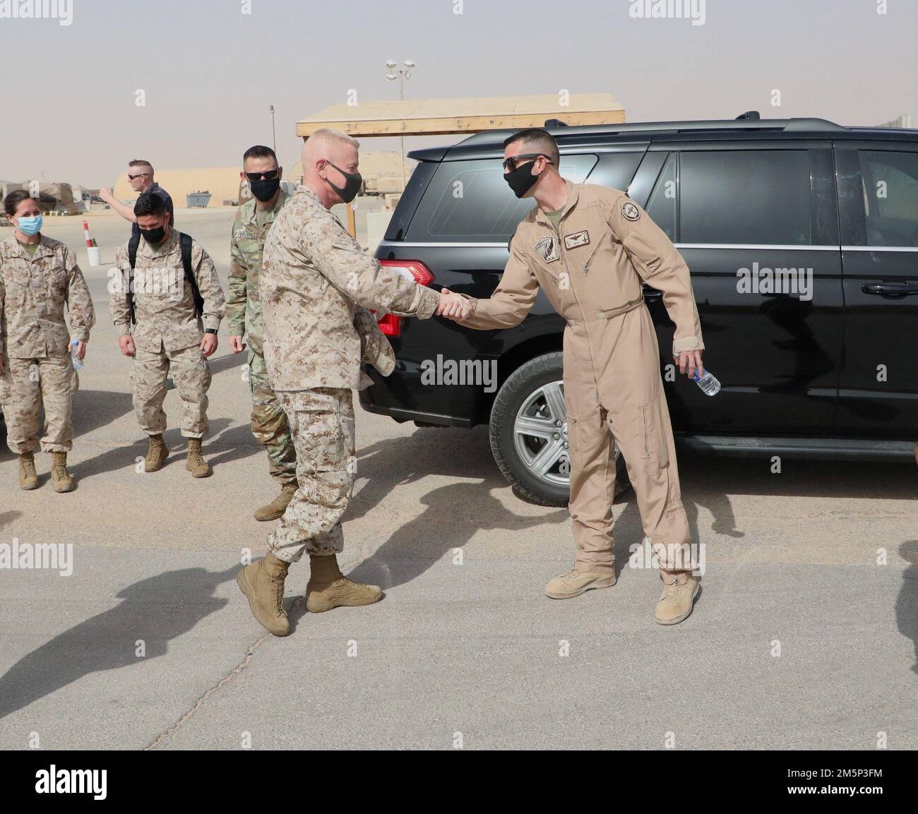 U.S. Marine Corps Maj. Gen. Paul Rock, Commander, U.S. Marine Corps Forces Central Command is greeted by Lt. Col. Timothy Miller, Commander, Marine Fighter Attack Squadron 115 (VMFA-115) during his visit to Prince Sultan Air Base, Kingdom of Saudi Arabia on Feb. 27, 2022. VMFA-115 has been deployed to Prince Sultan Air Base in the Kingdom of Saudi Arabia since December 2021 and are an integral part of the Immediate Response Force in the Central Command area of responsibility. Stock Photo