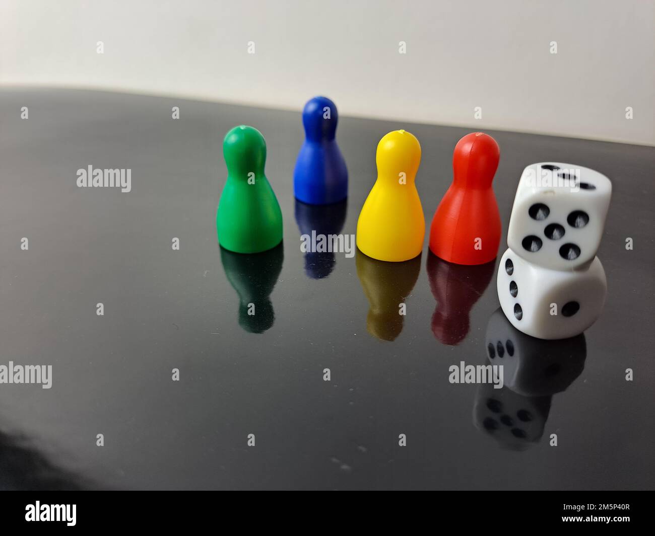 Board Game Pawns And Dice With Colored Pieces Stock Photo Alamy