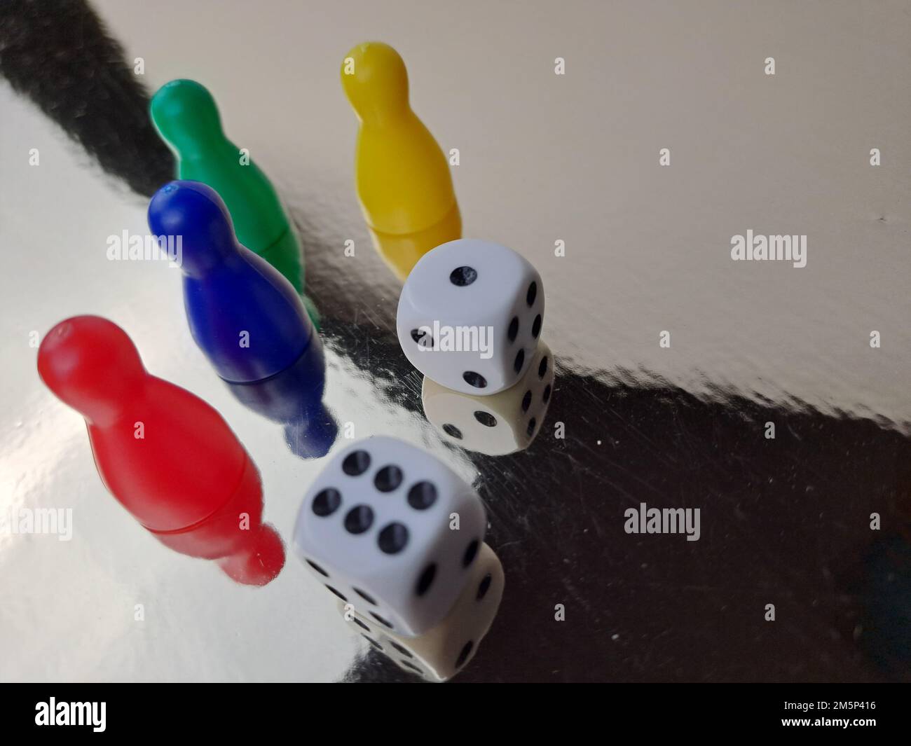 Board Game Pawns And Dice With Colored Pieces Stock Photo Alamy