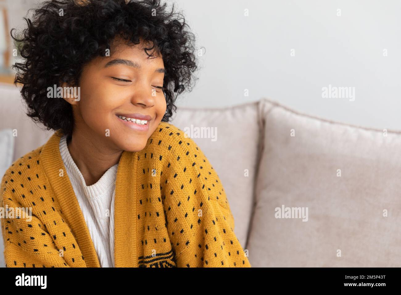 Beautiful african american girl with afro hairstyle smiling sitting on ...