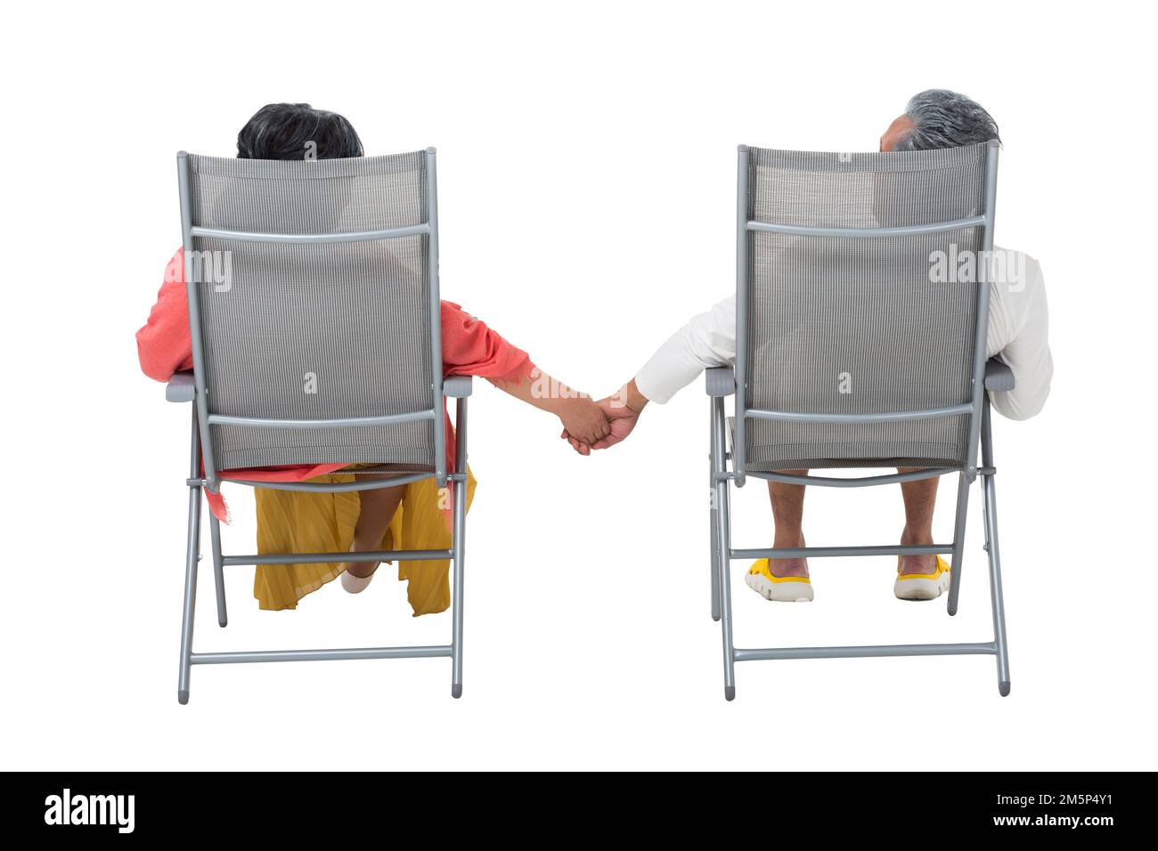 The elderly couple holding hands in beach chairs Stock Photo Alamy