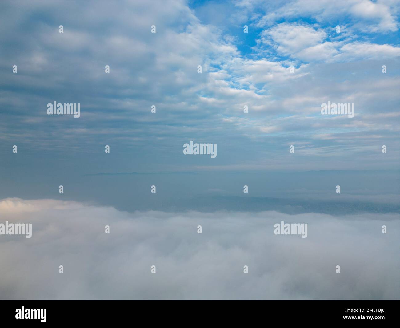 A landscape aerial view of skyline with white clouds on the horizon ...