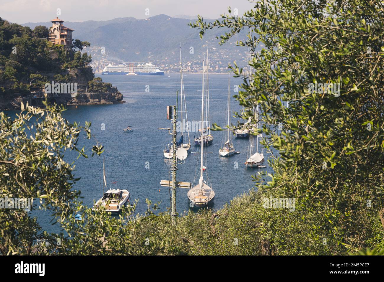 Bay of little seaside town Portofino with luxury yachts and boats.  Portofino is a fishing village on the Italian Riviera coastline, southeast of Geno Stock Photo