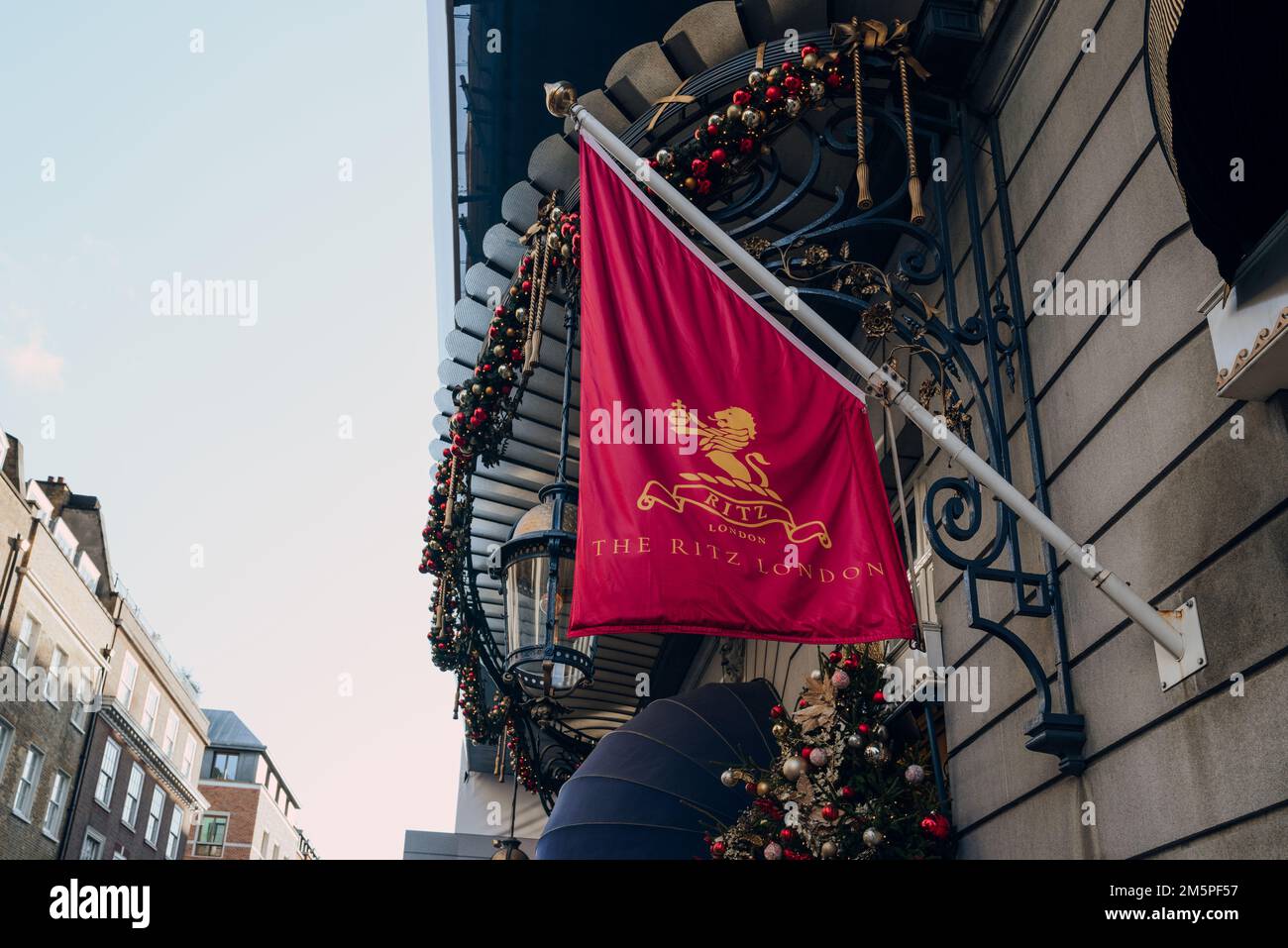 London, UK - December 26, 2022: Named flag on a pole by the entrance to The Ritz, London's most iconic hotel. Stock Photo
