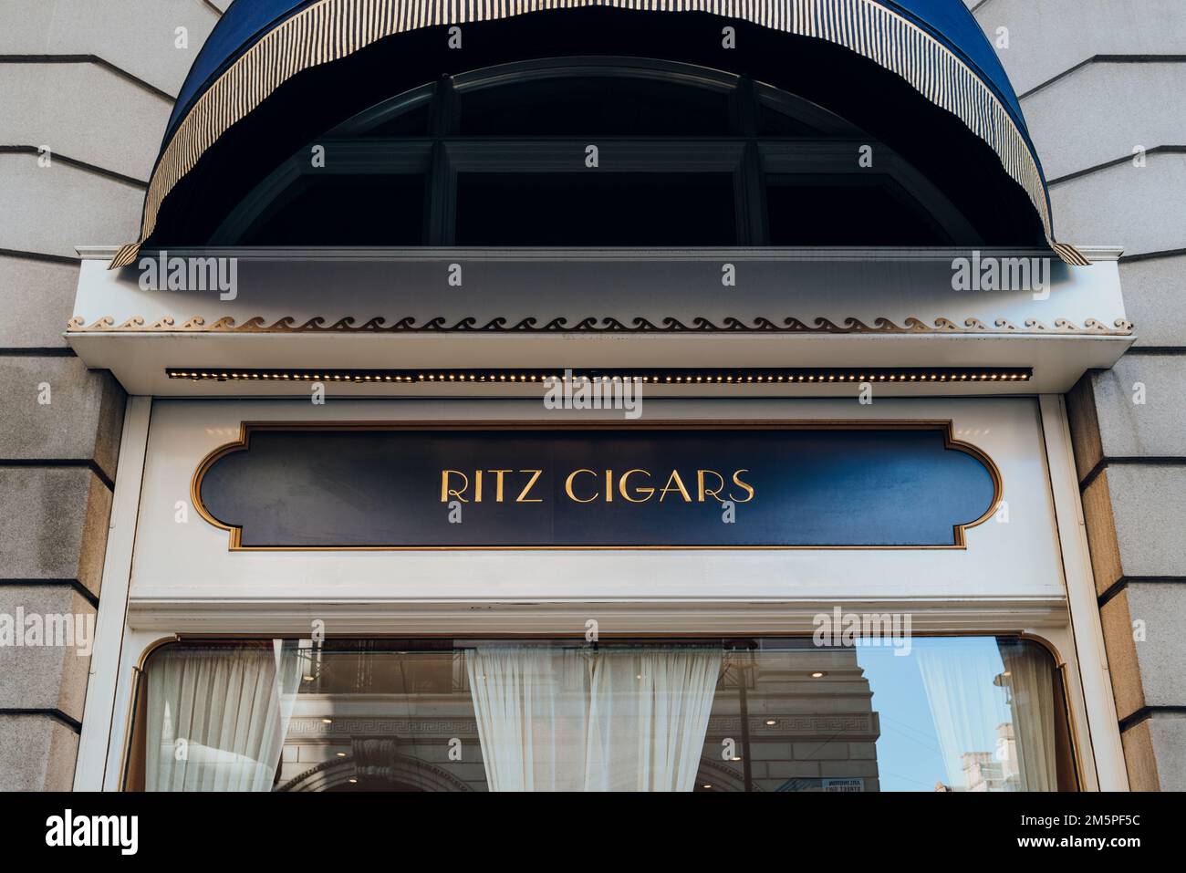 London, UK - December 26, 2022: Sign outside Ritz Cigars, a luxurious indoor cigar lounge in London with a prestigious selection sold in its premium c Stock Photo