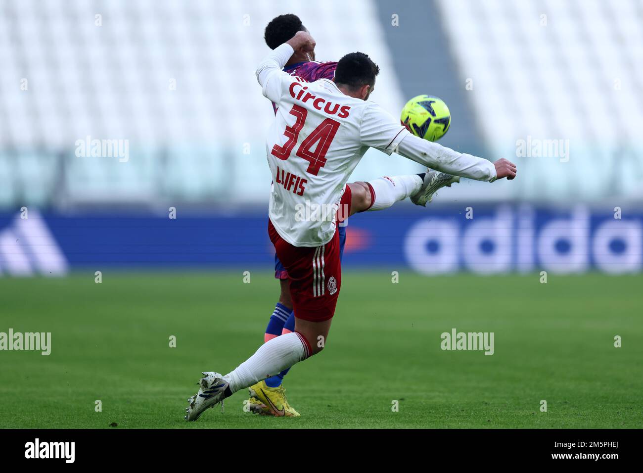 Marley Ake of Juventus Fc and Konstantinos Laifis of Standard de Liege battle for the ball during the friendly match beetween Juventus Fc and Standard de Liege  at Allianz Stadium on December 30, 2022 in Turin, Italy . Stock Photo