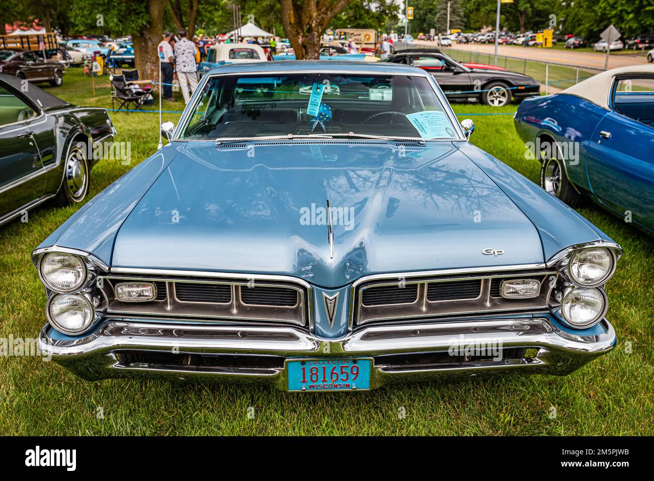Iola, WI - July 07, 2022: High perspective front view of a 1965 Pontiac Grand Prix Hardtop Coupe at a local car show. Stock Photo