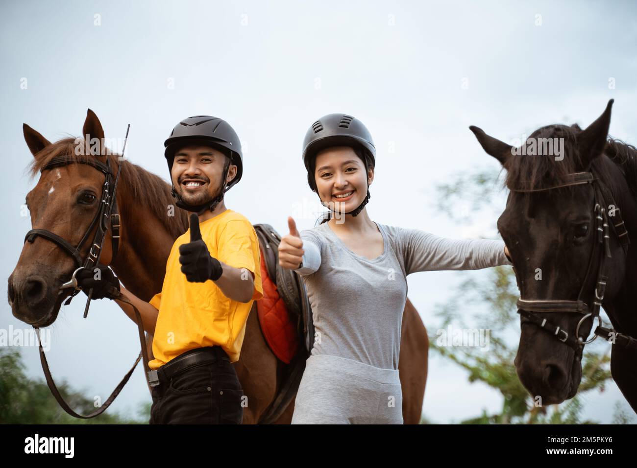 two equestrian athletes ride horses and start training Stock Photo Alamy