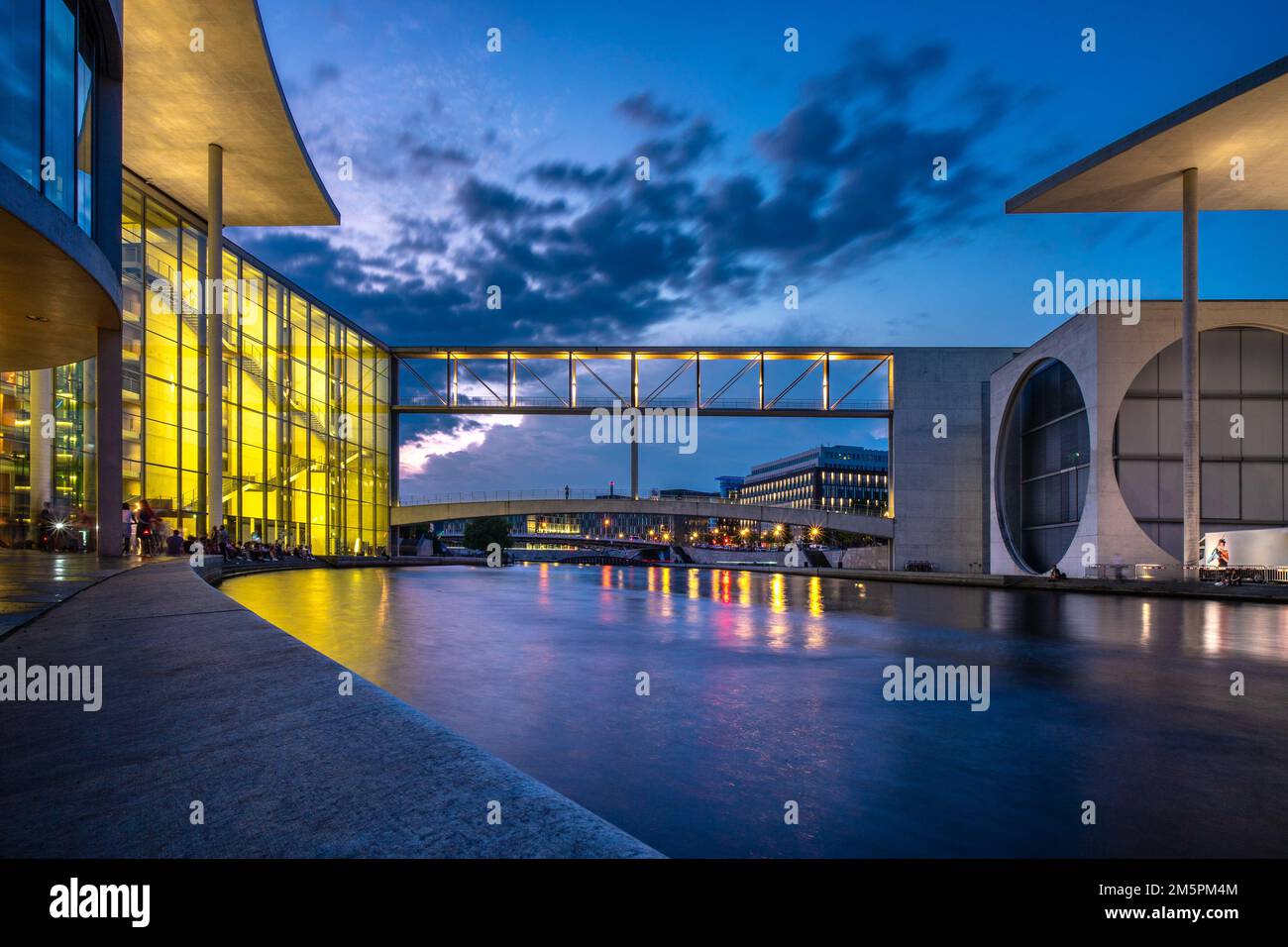 Berlin, Germany - June 25 2022: Sunset view of the Chancellery district, with Marie Elizabeth Lueders house and the walk bridge above Spree. Stock Photo