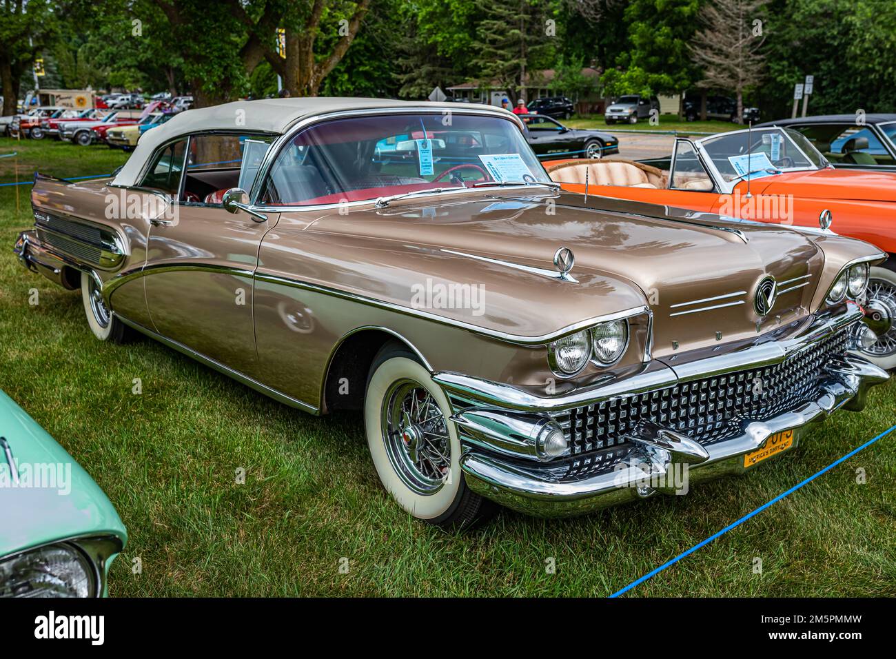 Iola, WI - July 07, 2022: High perspective front corner view of a 1958 Buick Century Convertible at a local car show. Stock Photo