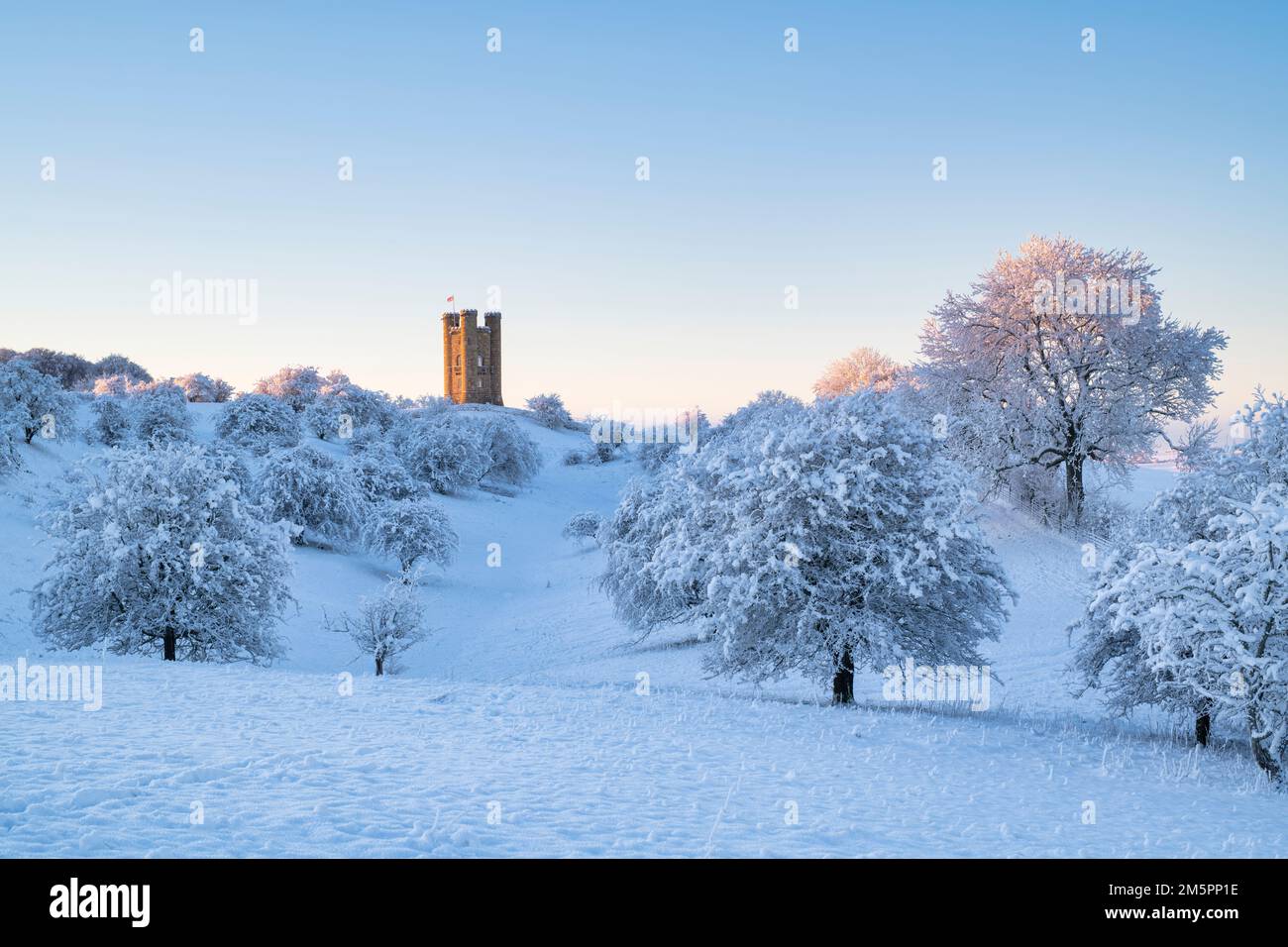 Broadway Tower at sunrise in the snow along the cotswold way. Broadway
