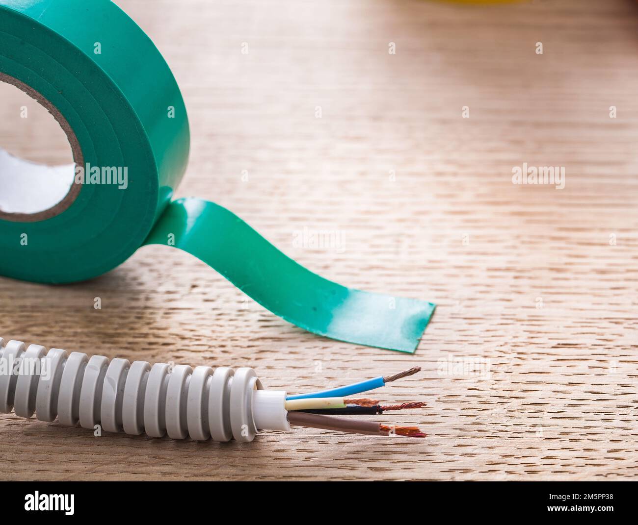 Electric corrugated pipe cables insulating tape electricity concept