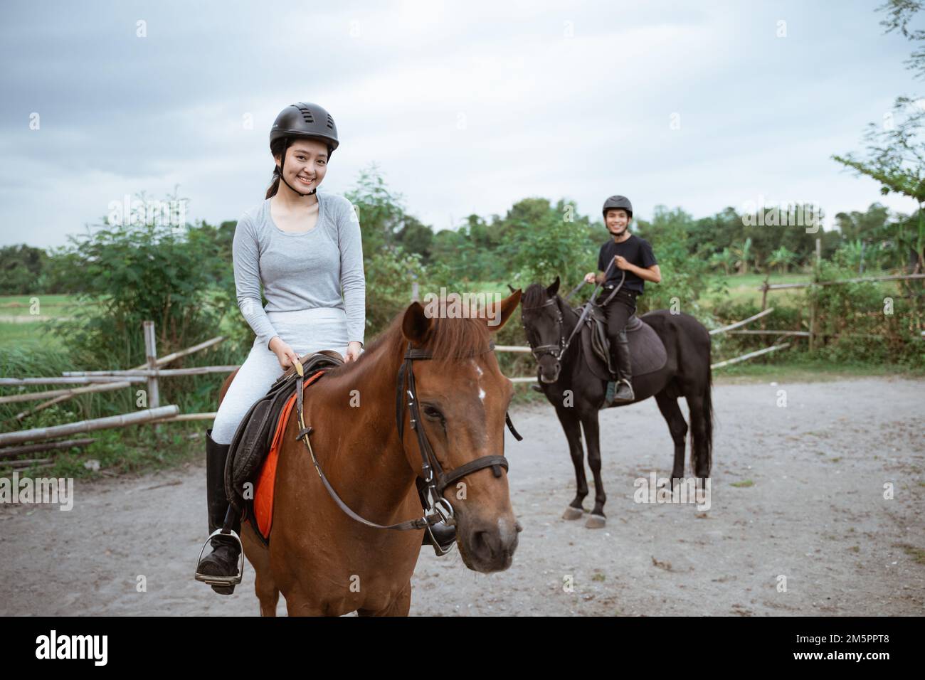 two equestrian athletes ride horses and start training Stock Photo