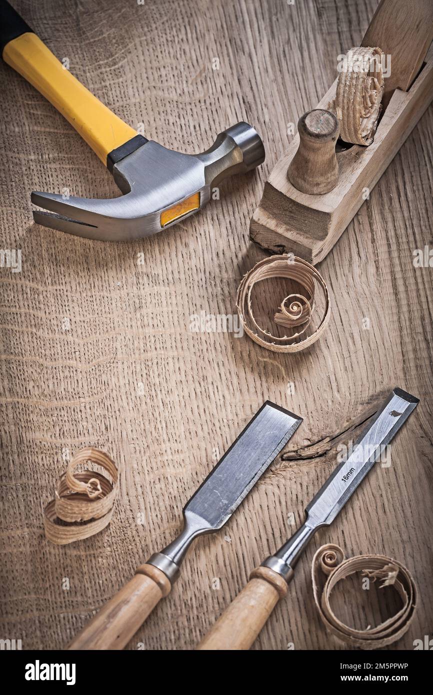 hammer planner chissels shavings on wood. Stock Photo