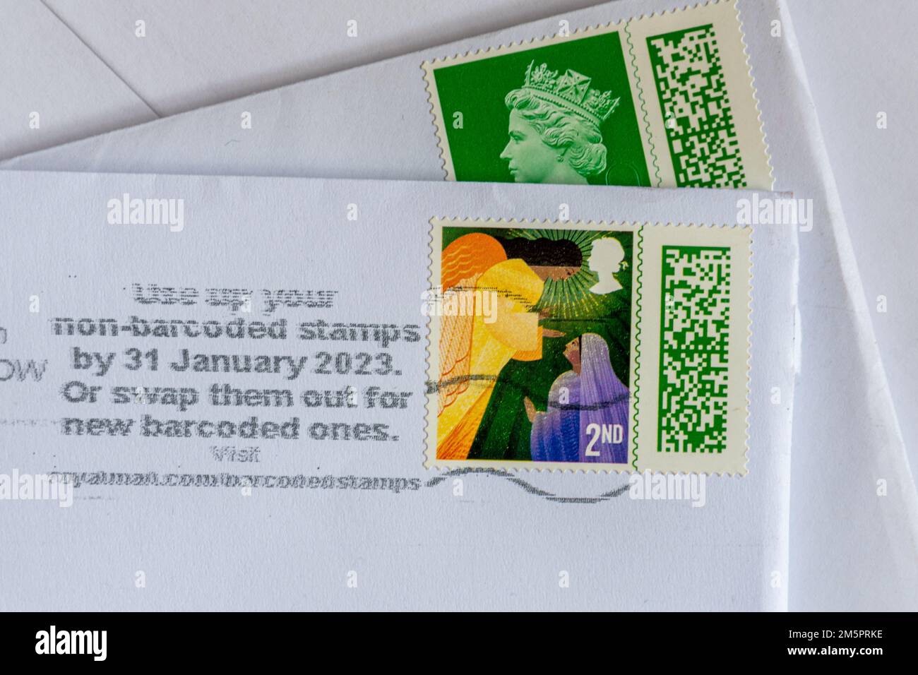 Use up your non-barcoded stamps by 31 January 2023 or swap them our for new barcoded ones, information stamped onto envelopes by Royal Mail, UK Stock Photo