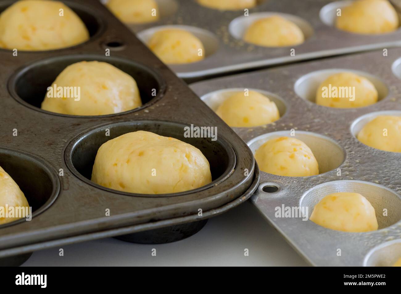 It is traditional Brazilian snack made at home by preparing and baking cheese buns Stock Photo