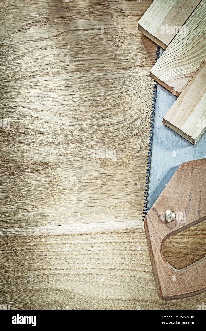 Sharp handsaw timber on wood board construction concept Stock Photo Alamy