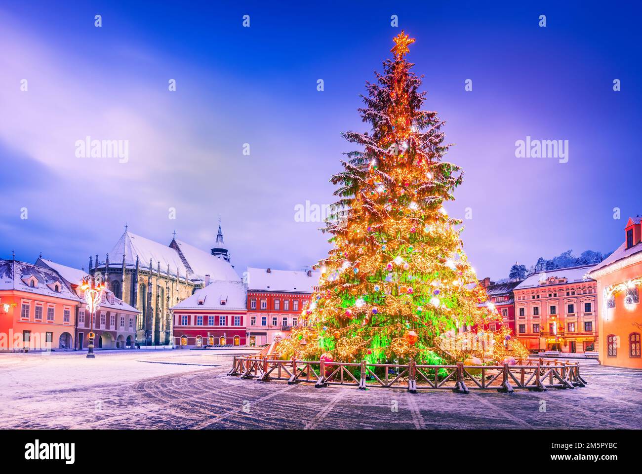 Brasov, Romania. Snowy scenic Main Square with Christmas Tree, winter holidays. Stock Photo