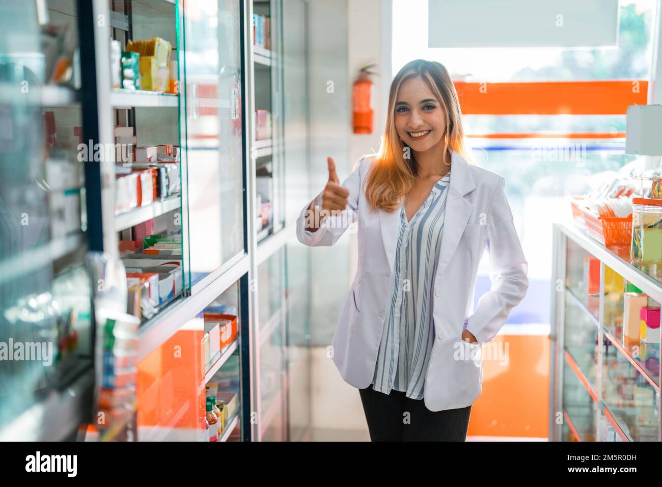 Attractive smiling woman pharmacist hi-res stock photography and images ...