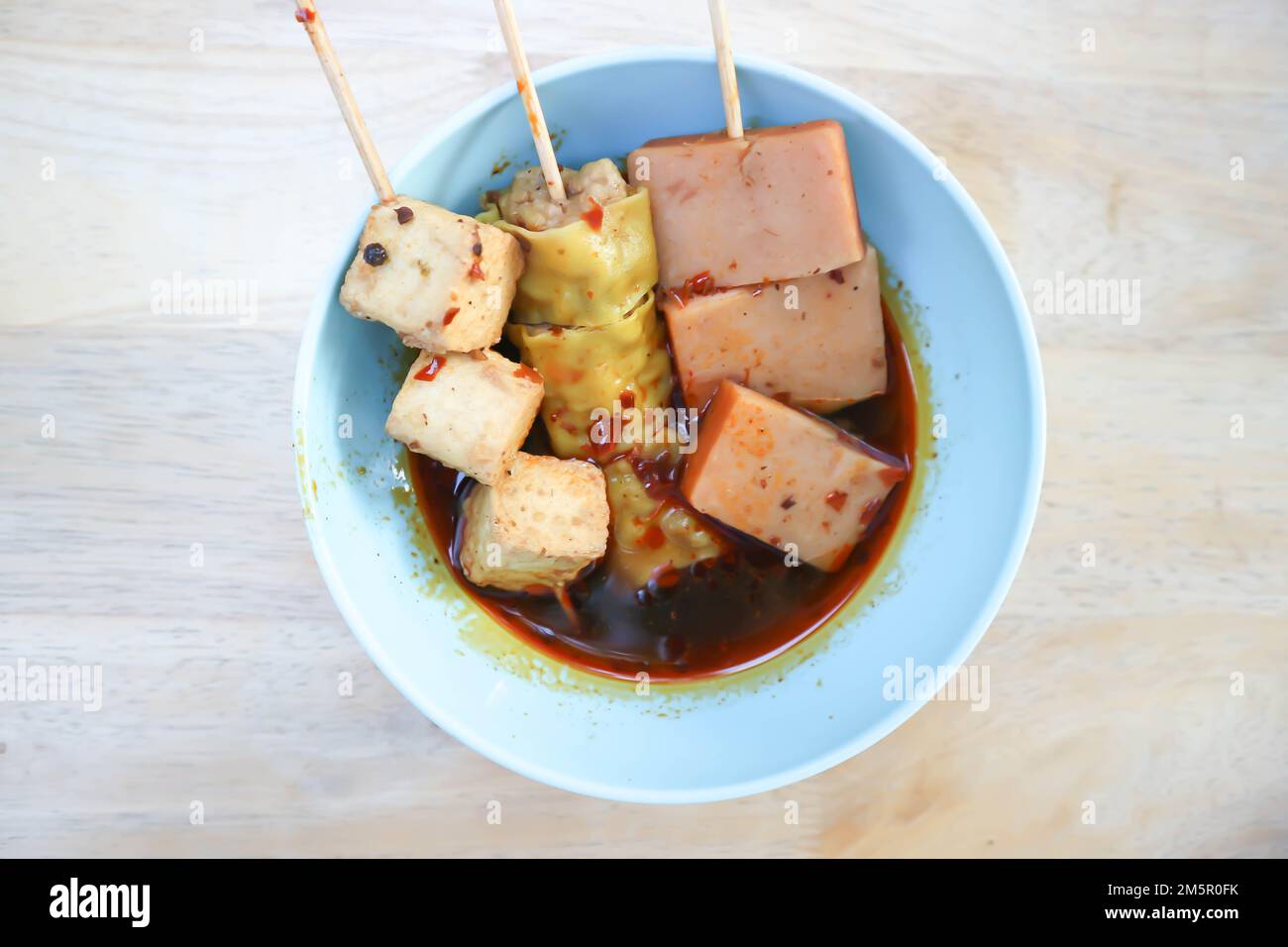 grilled tofu, wonton or Chinese dumpling or dumpling and sausage or