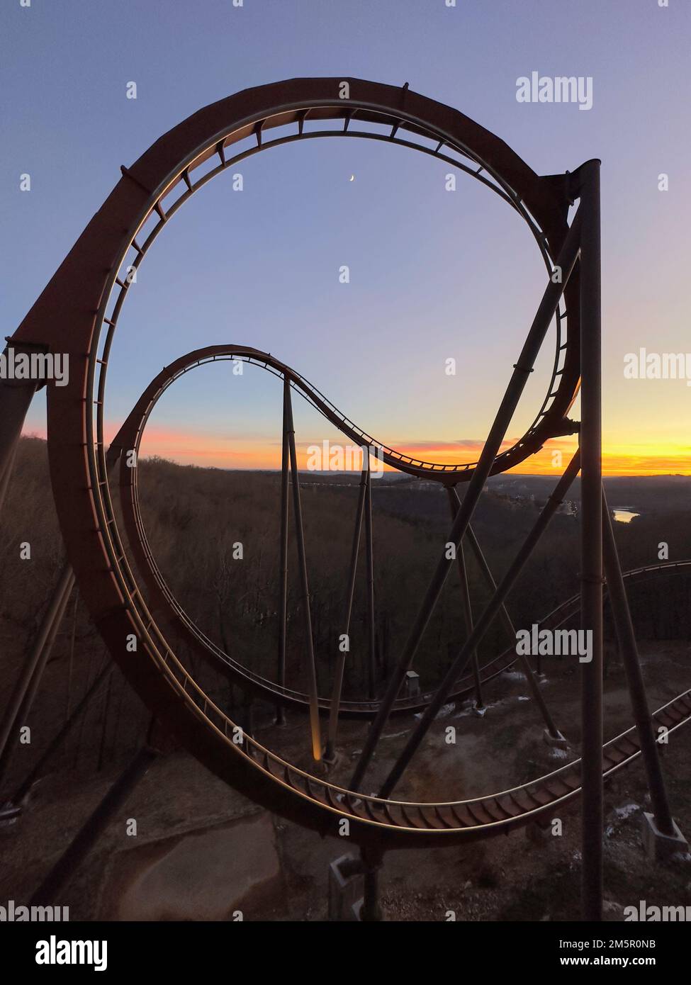Sunset behind Wildfire roller coaster at Silver Dollar City, Branson, Missouri. Abstract metal