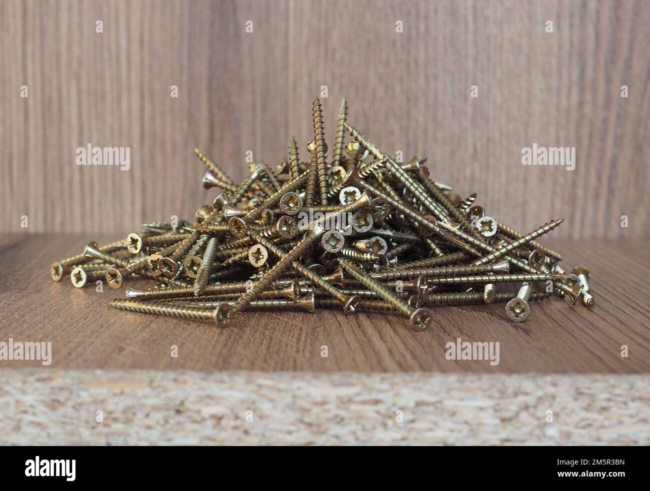 wood screws on melamine manufactured wood panel Stock Photo - Alamy