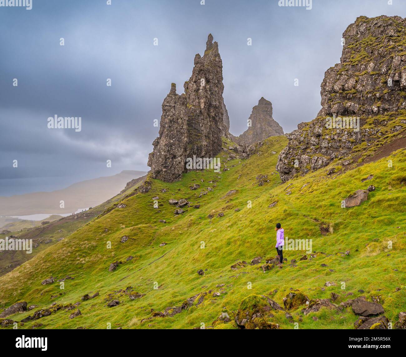 Walking at The Old Man of Storr Stock Photo
