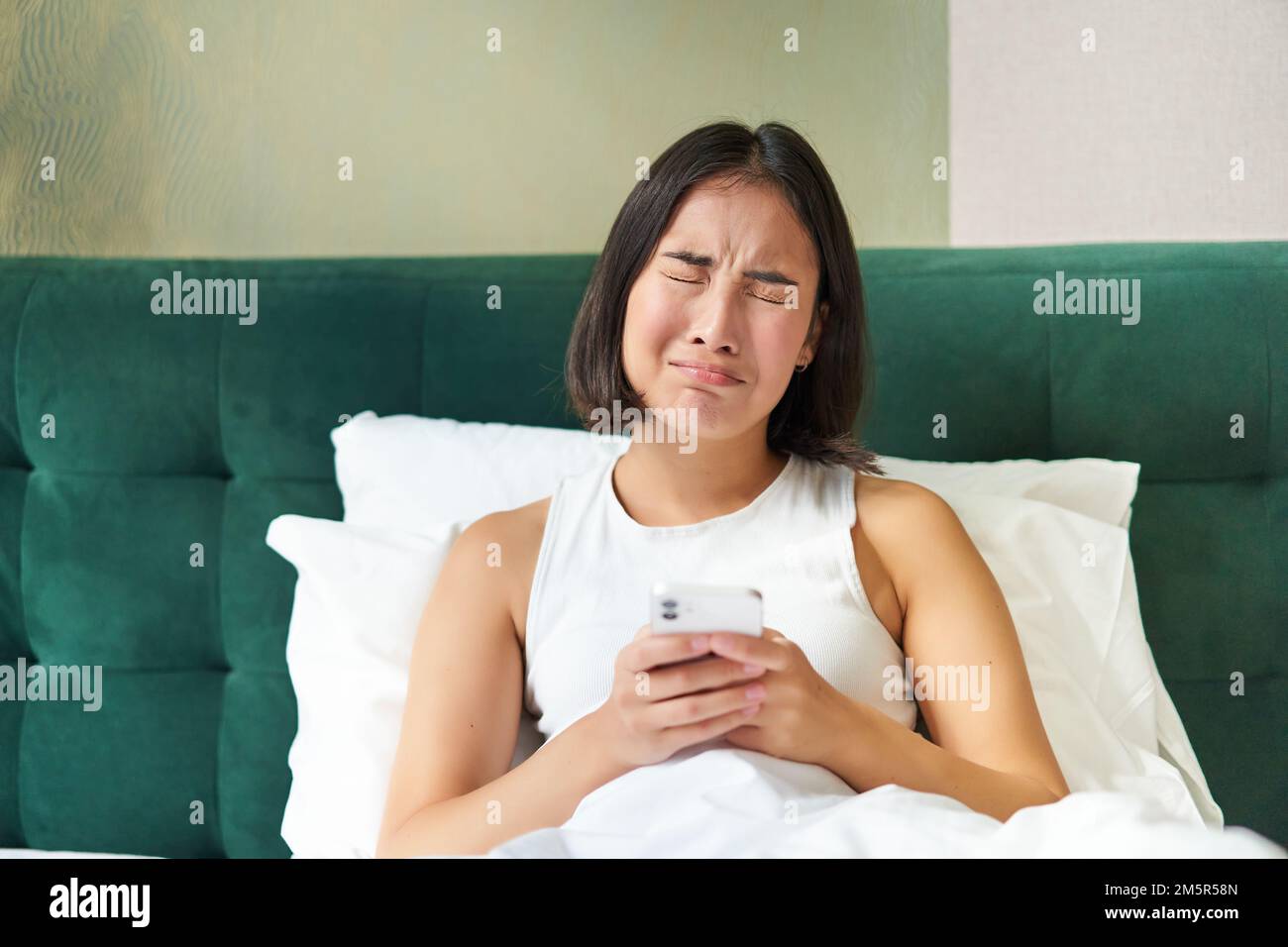 Asian woman crying in bed hi-res stock photography and images - Alamy