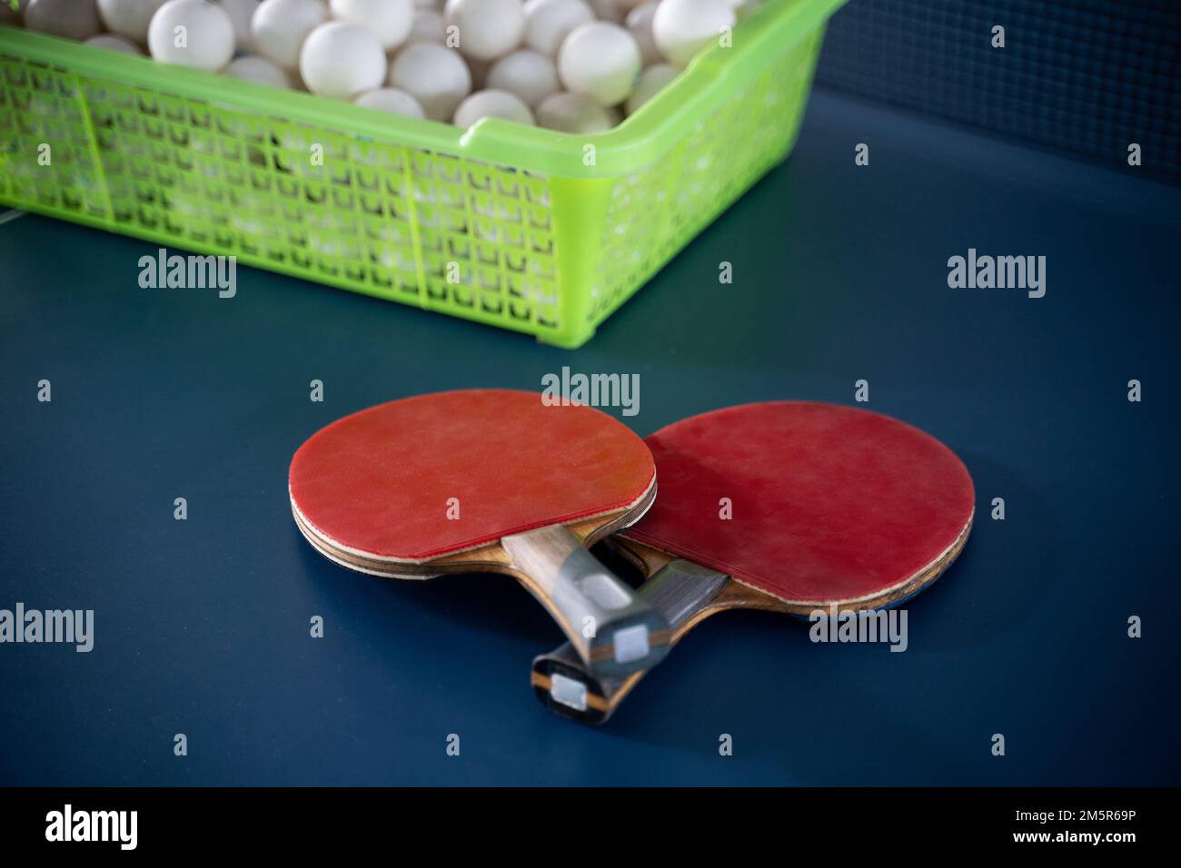 Two paddles with balls on a ping pong table Stock Photo