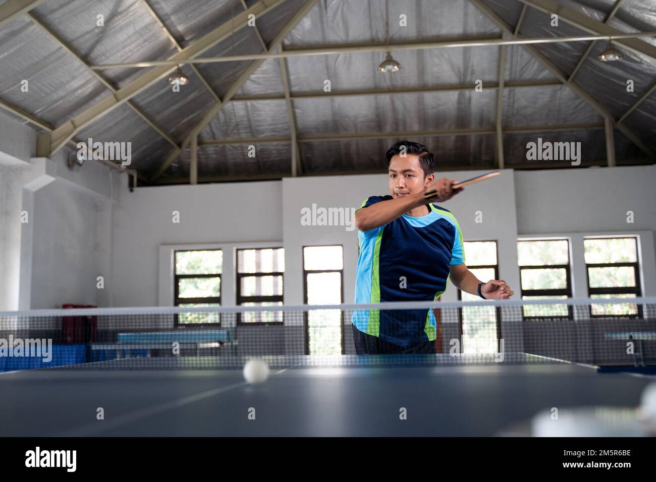 male ping pong athlete hitting forehand ball Stock Photo Alamy