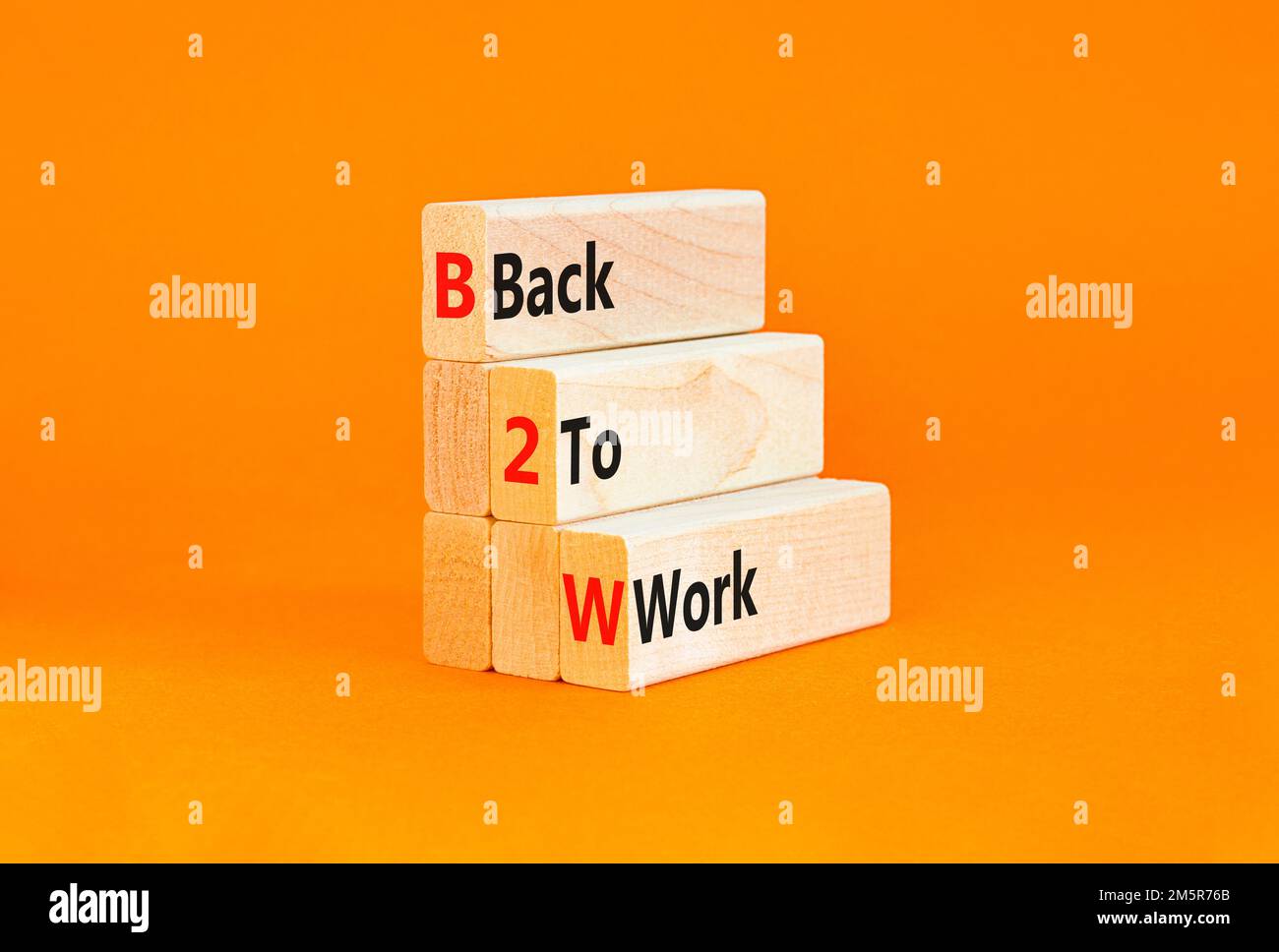Blue 2work B2W back to work symbol. Concept words B2W back to work on wooden ...
